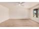 Spacious bedroom with modern wood floors and a large window at 9414 N 50Th Dr, Glendale, AZ 85302