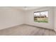 Bright bedroom featuring a modern ceiling fan and a window overlooking the backyard at 9414 N 50Th Dr, Glendale, AZ 85302