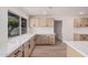 Modern kitchen with quartz countertops, sleek cabinets, and stainless steel appliances at 9414 N 50Th Dr, Glendale, AZ 85302