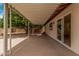 Covered patio of home, great for outdoor seating and backyard access through sliding glass door at 9414 N 50Th Dr, Glendale, AZ 85302