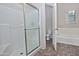 Bathroom featuring a tile shower, a bathtub, a toilet, and a window allowing natural light at 1015 S Val Vista Dr # 52, Mesa, AZ 85204