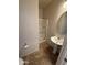 Full bathroom with walk-in shower, pedestal sink, tile flooring, and a mirror at 1015 S Val Vista Dr # 52, Mesa, AZ 85204