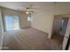 This spacious bedroom includes a ceiling fan, sliding glass door to patio, and bathroom access at 1015 S Val Vista Dr # 52, Mesa, AZ 85204