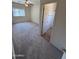 A carpeted bedroom features a ceiling fan, a bright window, and an en-suite bathroom for added convenience at 1015 S Val Vista Dr # 52, Mesa, AZ 85204