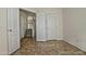 Bright bedroom with doors to hallway and tile floors at 1015 S Val Vista Dr # 52, Mesa, AZ 85204