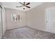 Neutral bedroom with a ceiling fan, carpet and a window at 1015 S Val Vista Dr # 52, Mesa, AZ 85204