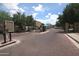 View of the community entrance with brick-paved road at 1015 S Val Vista Dr # 52, Mesa, AZ 85204