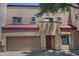 Two-story stucco home with red roof and two car garage at 1015 S Val Vista Dr # 52, Mesa, AZ 85204