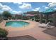Community pool with lounging chairs and manicured landscaping at 1015 S Val Vista Dr # 52, Mesa, AZ 85204