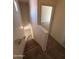 Carpeted staircase leading to upper level; tile flooring and walls on the ground floor at 1015 S Val Vista Dr # 52, Mesa, AZ 85204