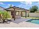 Inviting backyard featuring a built-in outdoor kitchen and a sparkling swimming pool perfect for entertaining at 10331 E Starion Ave, Mesa, AZ 85212
