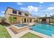 Stunning backyard featuring a pool, spa, pergola, and lush landscaping perfect for outdoor entertaining at 10331 E Starion Ave, Mesa, AZ 85212