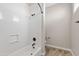 Functional bathroom featuring a shower-tub combo, neutral colors, and modern fixtures and hardware at 10331 E Starion Ave, Mesa, AZ 85212