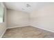 Comfortable bedroom features tile flooring, a bright window offering natural light, and neutral wall paint at 10331 E Starion Ave, Mesa, AZ 85212