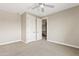 This bedroom is a neutral canvas with plush carpet and white trim and offers flexible design options at 10331 E Starion Ave, Mesa, AZ 85212