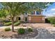 Charming two-story home with a well-manicured front yard and an attached two-car garage at 10331 E Starion Ave, Mesa, AZ 85212