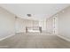 Bright and airy loft space with neutral carpet and plenty of room for entertainment at 10331 E Starion Ave, Mesa, AZ 85212