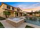 Backyard view of the pool, spa, outdoor kitchen and covered patio at 10331 E Starion Ave, Mesa, AZ 85212