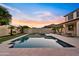 Backyard pool and spa area with mature landscaping and serene setting at 10331 E Starion Ave, Mesa, AZ 85212