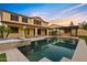 Backyard pool and spa area featuring a built in outdoor kitchen and fireplace, perfect for entertaining at 10331 E Starion Ave, Mesa, AZ 85212