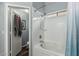 Bathroom showcasing a shower-over-tub with white tile surround and blue shower curtain at 11361 E Escondido Ave, Mesa, AZ 85208
