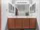 Well-lit bathroom with double vanity, spacious mirrors, and coordinated fixtures at 11361 E Escondido Ave, Mesa, AZ 85208