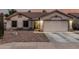 Beautiful single-story home featuring a well-maintained front yard with desert landscaping at 11361 E Escondido Ave, Mesa, AZ 85208