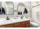 Bright bathroom with a double sink vanity, stylish mirrors, and modern fixtures, offering a clean design at 11658 E Chevelon Trl, Gold Canyon, AZ 85118