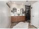 Stylish bathroom featuring double sinks, modern mirrors, and a sleek, tiled shower with a rainfall showerhead at 11658 E Chevelon Trl, Gold Canyon, AZ 85118