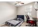 Cozy bedroom with a comfortable bed, modern desk setup, and plenty of natural light at 11658 E Chevelon Trl, Gold Canyon, AZ 85118