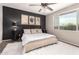 Cozy bedroom with plush carpet, a large bed, and natural light from the window at 11658 E Chevelon Trl, Gold Canyon, AZ 85118