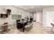 Bright dining area with a decorative wooden table, modern decor, and tile flooring throughout at 11658 E Chevelon Trl, Gold Canyon, AZ 85118