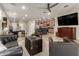 Cozy living room with kitchen view, neutral tile, and modern furnishings, perfect for entertaining at 11658 E Chevelon Trl, Gold Canyon, AZ 85118