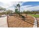 Community playground with a slide, climbing structures, and picnic area, perfect for Gathering fun and recreation at 11658 E Chevelon Trl, Gold Canyon, AZ 85118