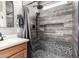 Beautiful shower with gray wood-look tile, black fixtures, and a convenient shower niche at 11658 E Chevelon Trl, Gold Canyon, AZ 85118