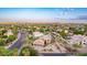 Breathtaking aerial view of a luxury home showcasing its landscaped grounds and desirable location in a scenic neighborhood at 12015 S Tuzigoot Dr, Phoenix, AZ 85044