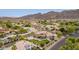 Stunning desert neighborhood view with lush landscaping, mountains, and well-maintained homes at 12015 S Tuzigoot Dr, Phoenix, AZ 85044