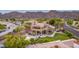 Beautiful estate boasting mountain views, a sparkling pool and spa, outdoor living spaces and mature landscaping at 12015 S Tuzigoot Dr, Phoenix, AZ 85044