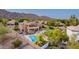 An impressive backyard featuring a pool, lush landscaping and plenty of privacy, and views of the surrounding mountains at 12015 S Tuzigoot Dr, Phoenix, AZ 85044