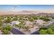 Stunning aerial shot of a desert community, highlighting the custom homes and beautiful mountain views at 12015 S Tuzigoot Dr, Phoenix, AZ 85044