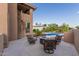 Backyard patio with a firepit surrounded by seating, offering a cozy outdoor entertainment area at 12015 S Tuzigoot Dr, Phoenix, AZ 85044