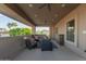 Spacious covered balcony with comfortable seating, perfect for enjoying the outdoor scenery at 12015 S Tuzigoot Dr, Phoenix, AZ 85044