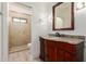 Bathroom featuring stylish vanity, mirror, and a glass-enclosed shower for a modern touch at 12015 S Tuzigoot Dr, Phoenix, AZ 85044
