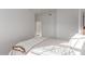 Cozy bedroom featuring bright light, a door, and a bed with a neutral color scheme and plush bedding at 12015 S Tuzigoot Dr, Phoenix, AZ 85044
