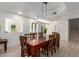 Dining room with wood table, decorative lighting and open space perfect for gatherings at 12015 S Tuzigoot Dr, Phoenix, AZ 85044