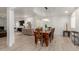 Open dining room with wood table, bright lighting, and modern accents at 12015 S Tuzigoot Dr, Phoenix, AZ 85044