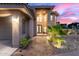 Inviting home entrance showcasing the elegant front door, tiled walkway, and manicured landscaping at 12015 S Tuzigoot Dr, Phoenix, AZ 85044