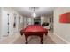 Inviting game room with pool table, fireplace, and natural light at 12015 S Tuzigoot Dr, Phoenix, AZ 85044