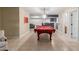 Spacious game room featuring a pool table, bar area, and neutral paint at 12015 S Tuzigoot Dr, Phoenix, AZ 85044
