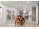Open concept kitchen with wood table and custom cabinets offering both style and functionality at 12015 S Tuzigoot Dr, Phoenix, AZ 85044